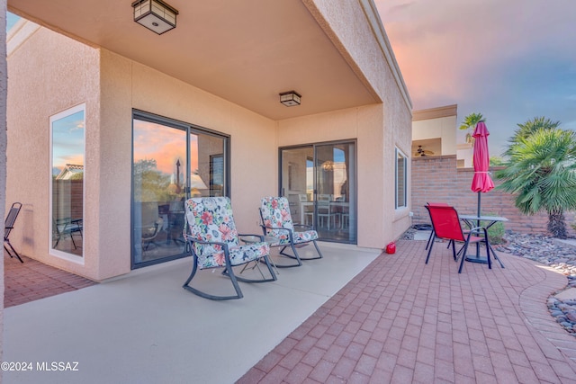 view of patio terrace at dusk