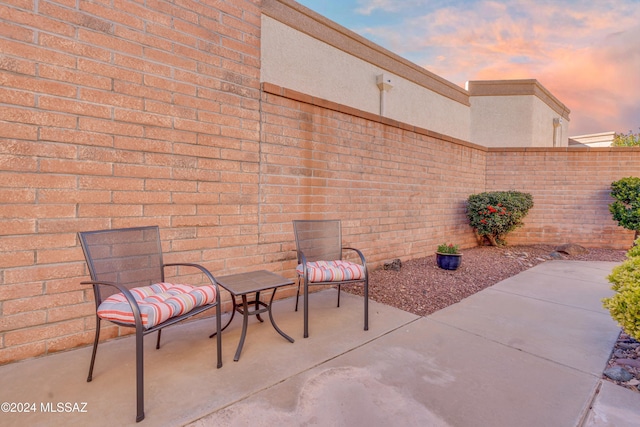 view of patio terrace at dusk