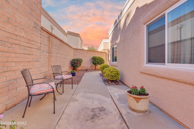 view of patio terrace at dusk