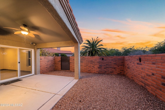 patio terrace at dusk with ceiling fan