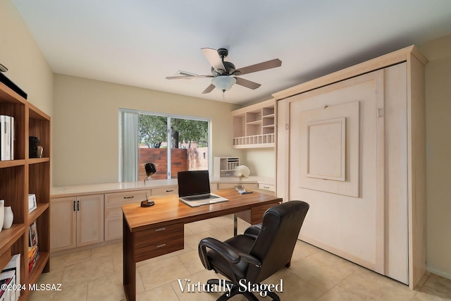 tiled office space featuring ceiling fan