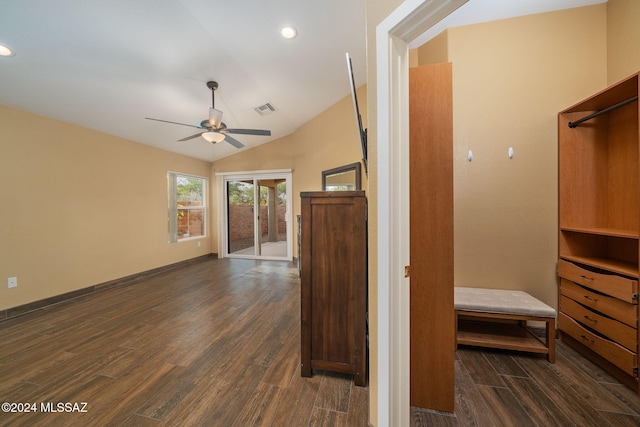 interior space featuring ceiling fan, dark hardwood / wood-style flooring, and vaulted ceiling