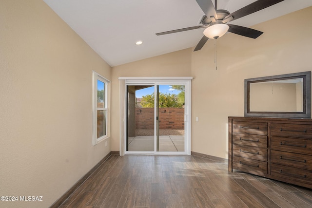 unfurnished room featuring ceiling fan, lofted ceiling, and dark wood-type flooring