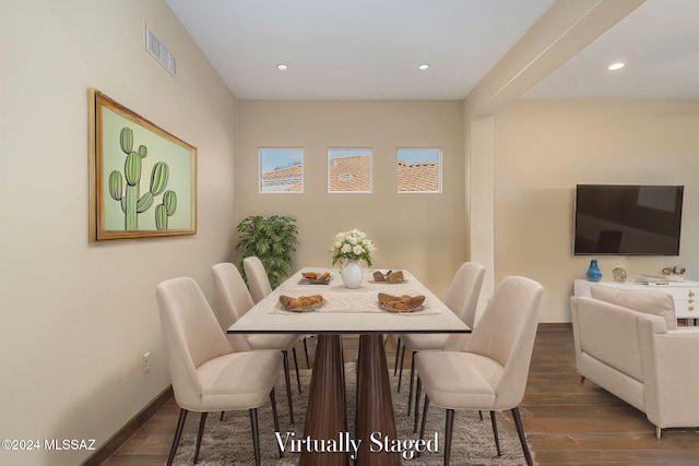 dining space featuring dark hardwood / wood-style floors