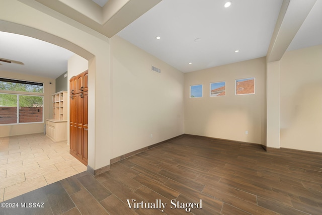 unfurnished room with wood-type flooring