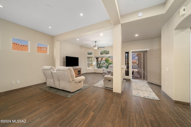 living room featuring dark hardwood / wood-style floors and ceiling fan