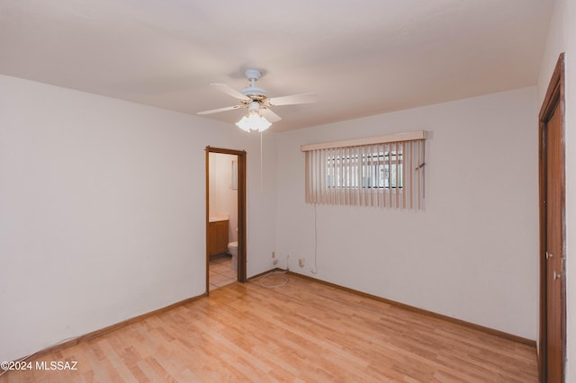 empty room with hardwood / wood-style flooring