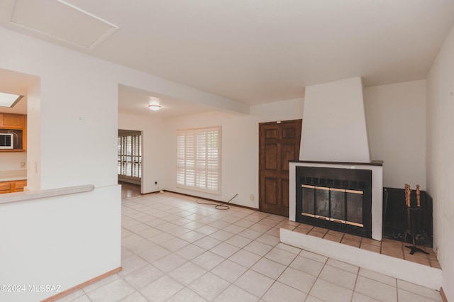 laundry room featuring light tile patterned flooring and washing machine and clothes dryer