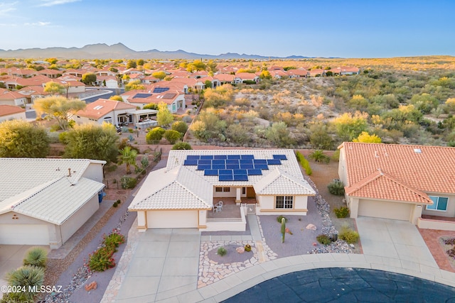 birds eye view of property featuring a mountain view