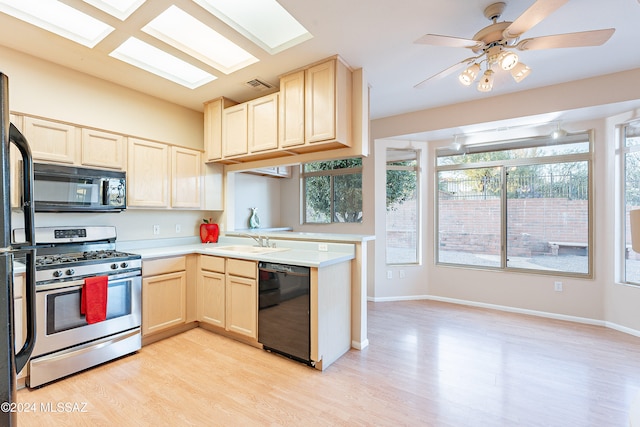 kitchen with ceiling fan, sink, black appliances, and light wood-type flooring