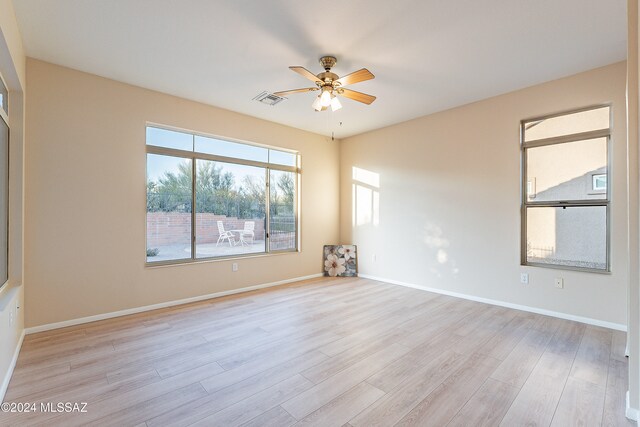 unfurnished room with ceiling fan and light hardwood / wood-style flooring