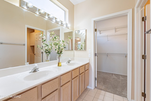 bathroom featuring tile patterned flooring and vanity