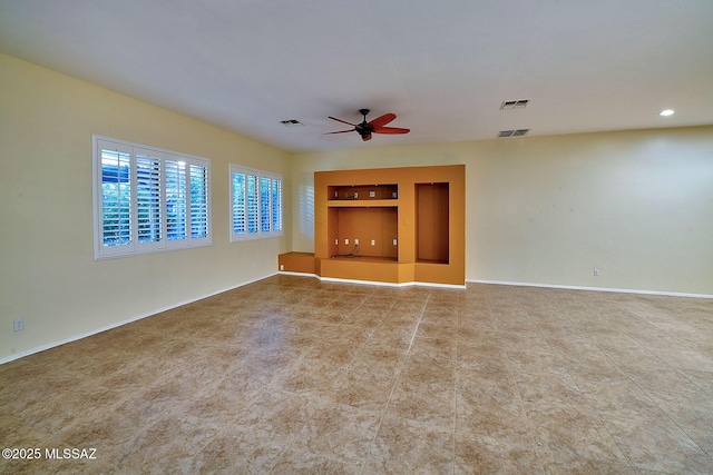 unfurnished living room with ceiling fan and built in features