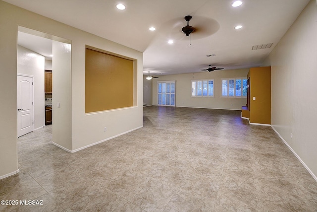 unfurnished living room featuring ceiling fan