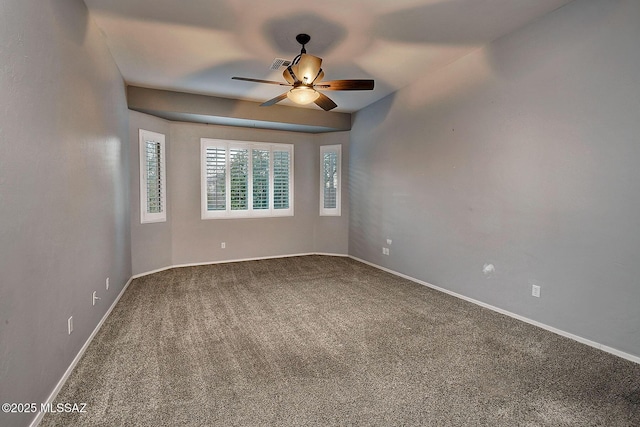 spare room with carpet and ceiling fan