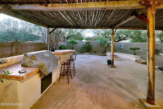 view of patio with an outdoor bar