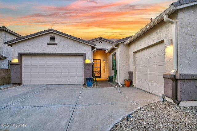 ranch-style home with a garage