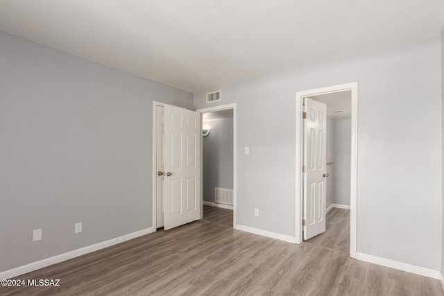 unfurnished bedroom with light hardwood / wood-style flooring