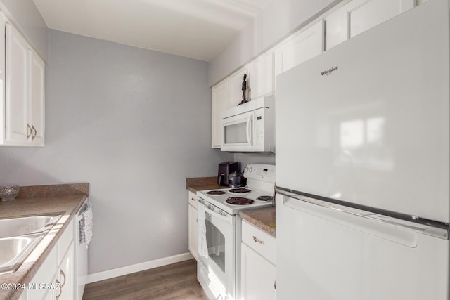 kitchen with white appliances, white cabinetry, dark wood-type flooring, and sink