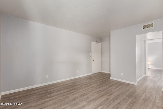 unfurnished room featuring hardwood / wood-style floors