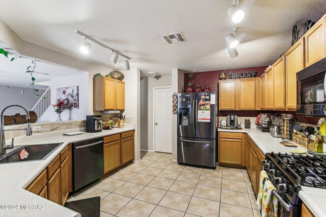 3457 N Crystal Hill Ave, Tucson, AZ 85745 - kitchen featuring stainless steel refrigerator with ice dispenser, dishwashing machine, track lighting, a sink, and light countertops