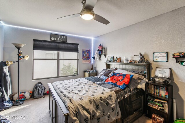 3457 N Crystal Hill Ave, Tucson, AZ 85745 - bedroom with carpet floors, a textured wall, and ceiling fan