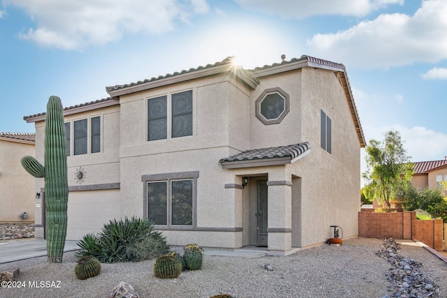 3457 N Crystal Hill Ave, Tucson, AZ 85745 - view of front of house featuring a garage, a tile roof, and stucco siding