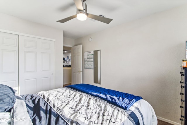 bedroom with ceiling fan and a closet