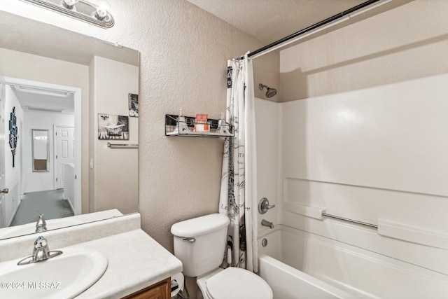 full bathroom featuring a textured ceiling, vanity, toilet, and shower / bath combo with shower curtain