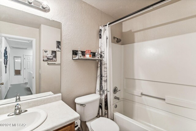3457 N Crystal Hill Ave, Tucson, AZ 85745 - bathroom featuring a textured wall, shower / bath combination with curtain, toilet, and vanity