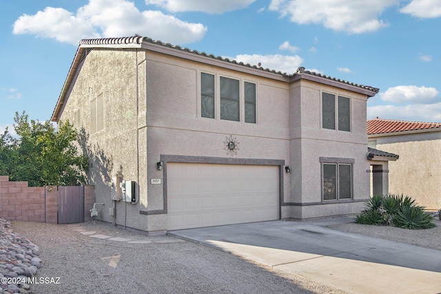 3457 N Crystal Hill Ave, Tucson, AZ 85745 - view of front of property featuring an attached garage, stucco siding, driveway, and a tile roof