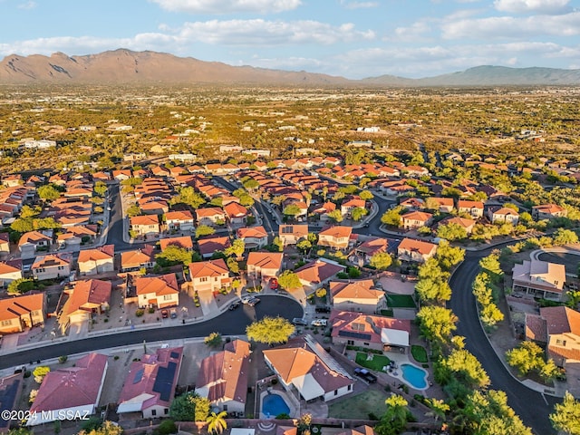 birds eye view of property with a mountain view