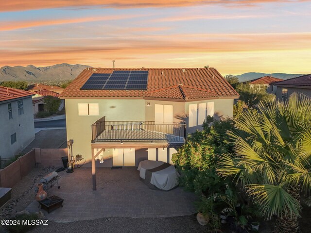 3457 N Crystal Hill Ave, Tucson, AZ 85745 - rear view of property featuring solar panels, stucco siding, a patio, and a balcony