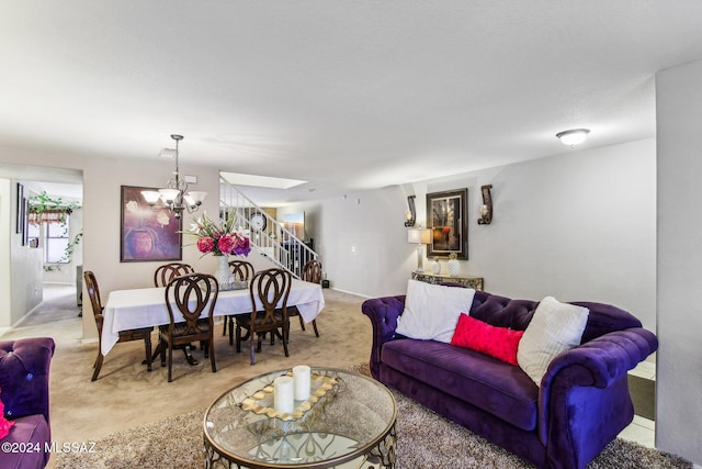 living room with light colored carpet and a chandelier