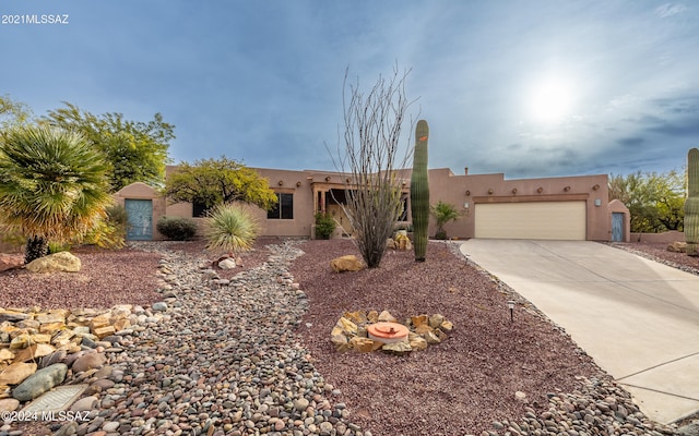 adobe home featuring a garage