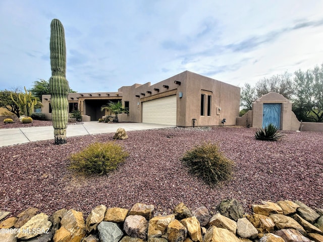 adobe home featuring a garage