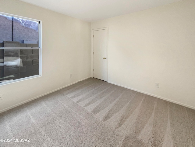 empty room featuring carpet flooring