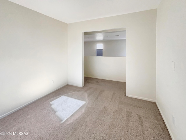 unfurnished room featuring carpet flooring