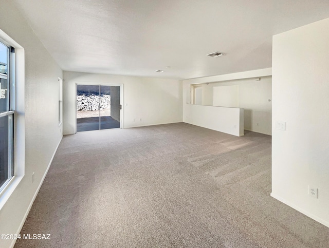 unfurnished living room with carpet flooring