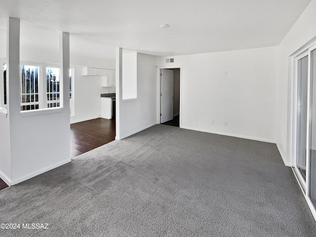 empty room with dark hardwood / wood-style floors