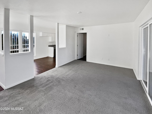 1600 N Wilmot Rd Unit 291, Tucson, AZ 85712 - spare room with dark carpet and baseboards