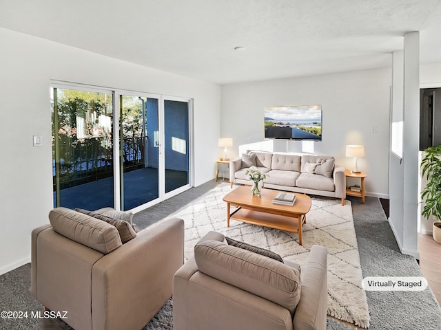1600 N Wilmot Rd Unit 291, Tucson, AZ 85712 - carpeted living room featuring baseboards