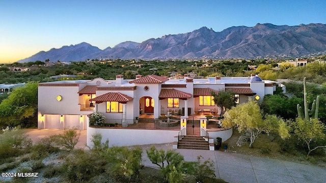 view of front of house with a mountain view and a garage