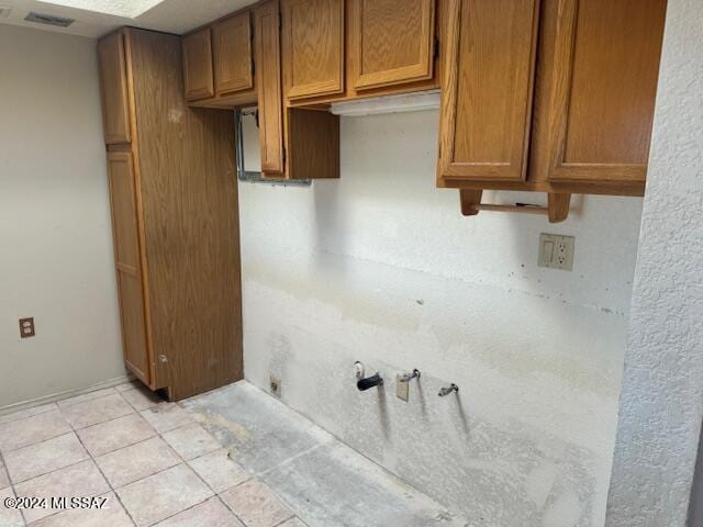 washroom featuring light tile patterned flooring