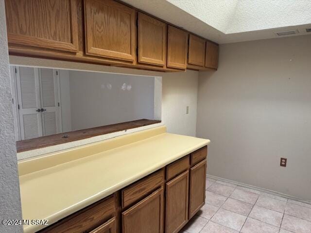 kitchen featuring light tile patterned flooring