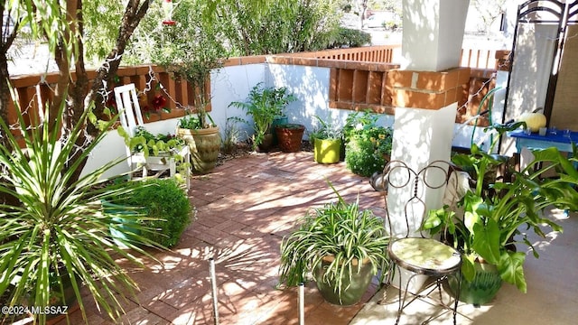 view of patio / terrace featuring fence