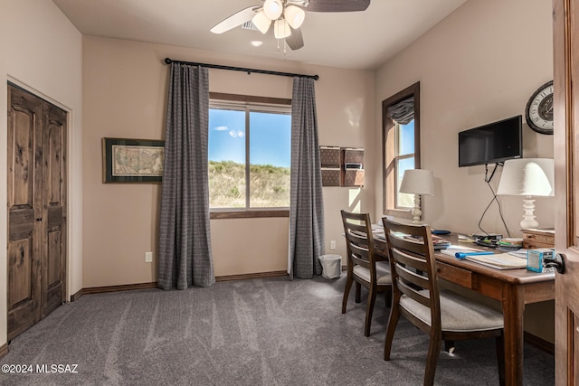 carpeted home office with ceiling fan