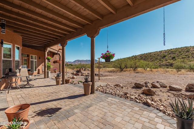 view of patio / terrace featuring a mountain view