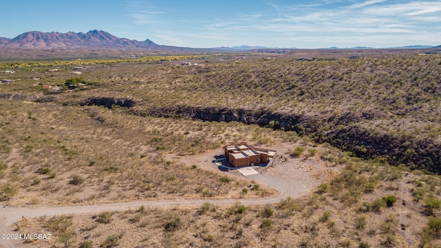 birds eye view of property featuring a mountain view