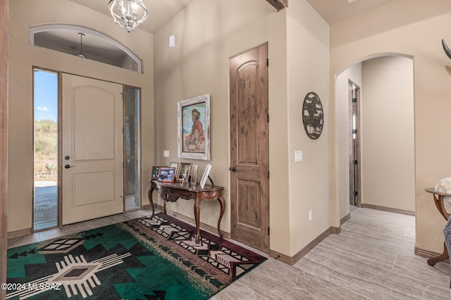 foyer featuring a notable chandelier